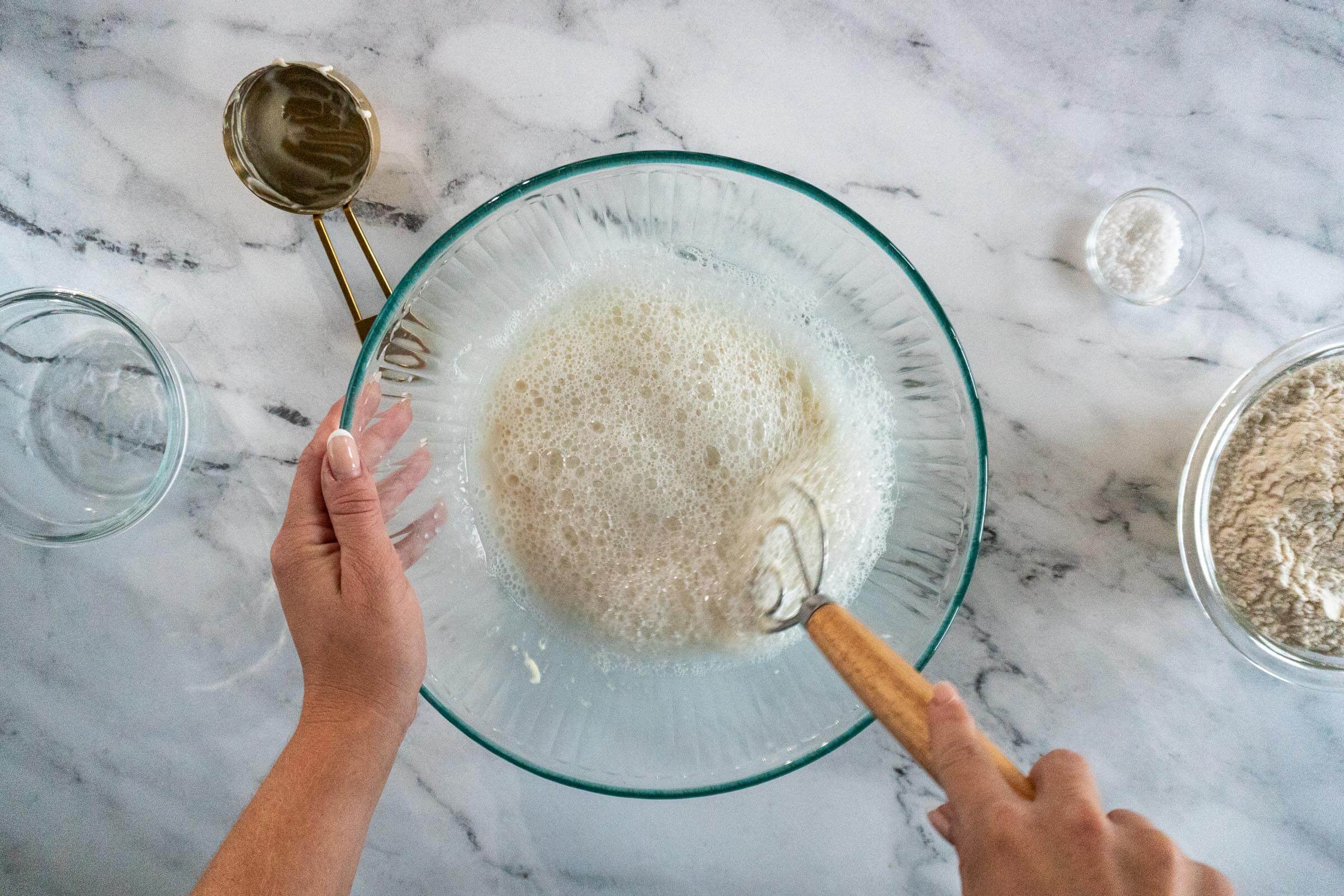 Whisking water and starter.