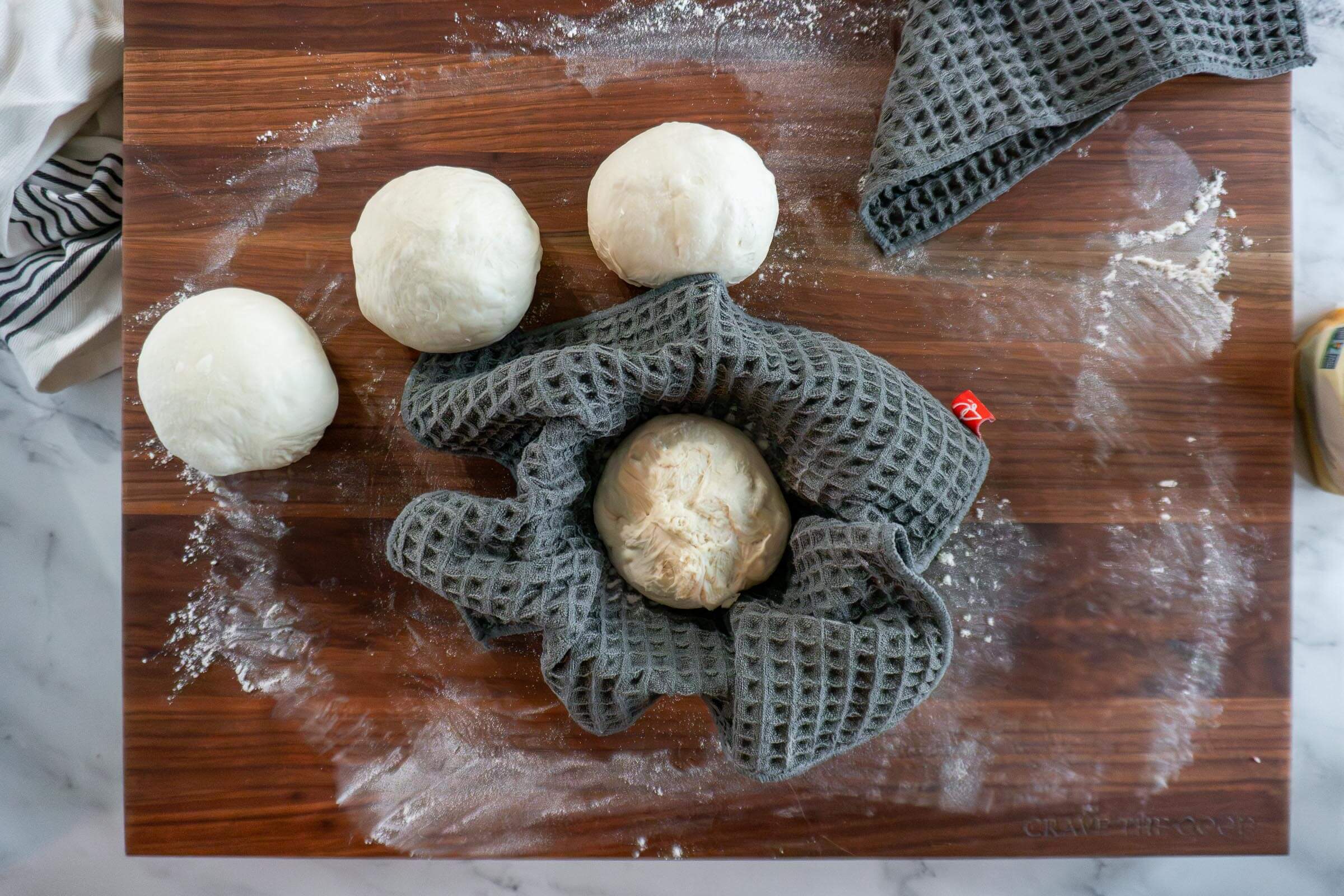 Shaped bread bowl in a cloth lined cereal bowl.