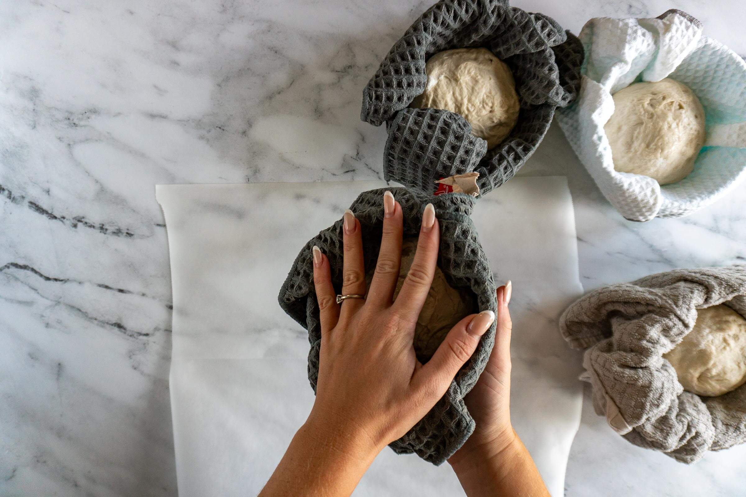 Turning bread bowl out of proofing bowl.