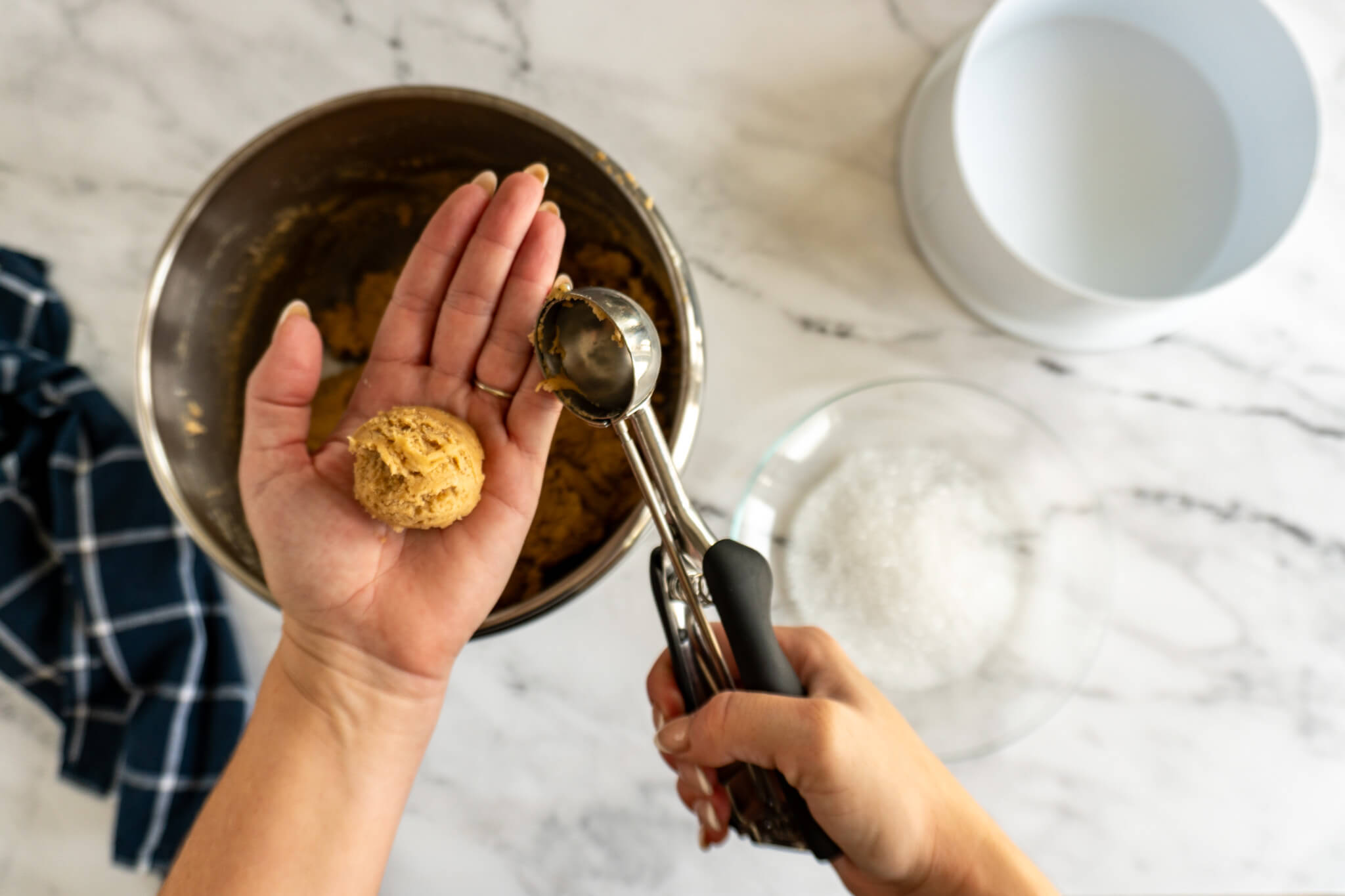 Cookie dough in woman's hand. 