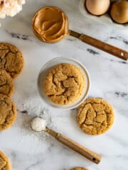 Overhead view of sourdough peanut butter cookies on a white stand.