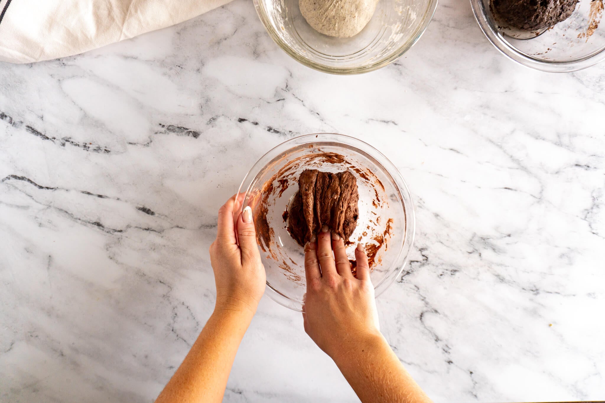 Folding cocoa sourdough. 