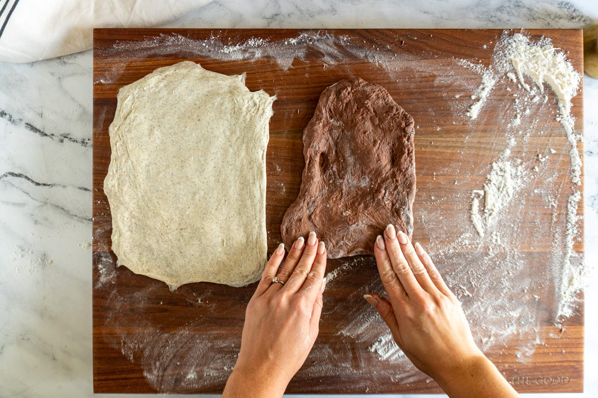 Pressing the cocoa powder sourdough into a rectangle. 