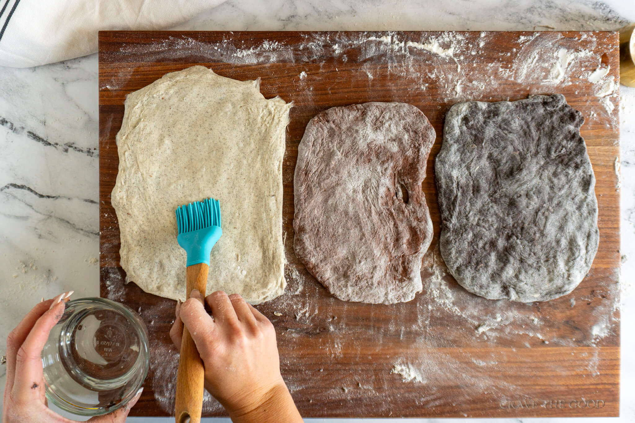 Brushing vanilla sourdough with water. 