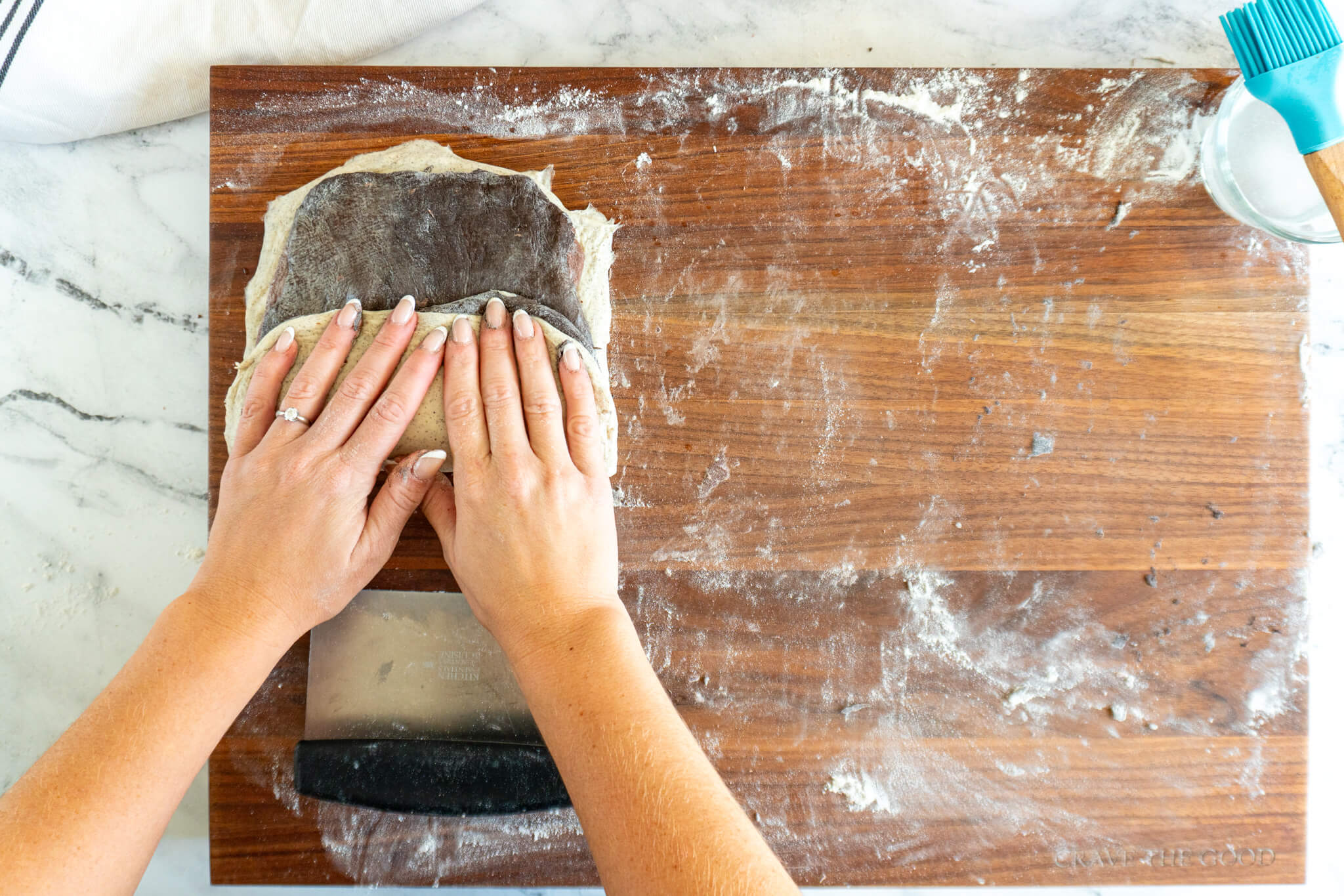 Folding up the bottom of the laminated doughs. 