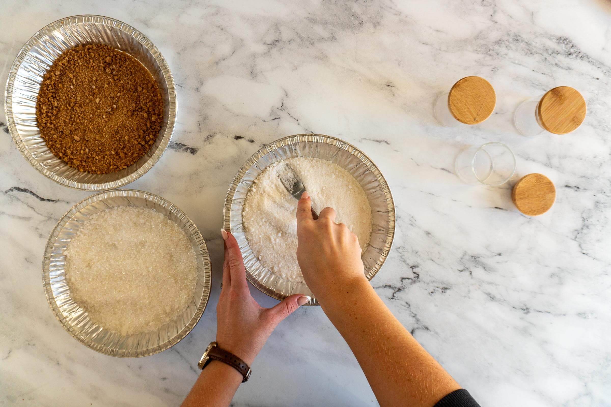Mashing smoked sugar clumps with a fork. 