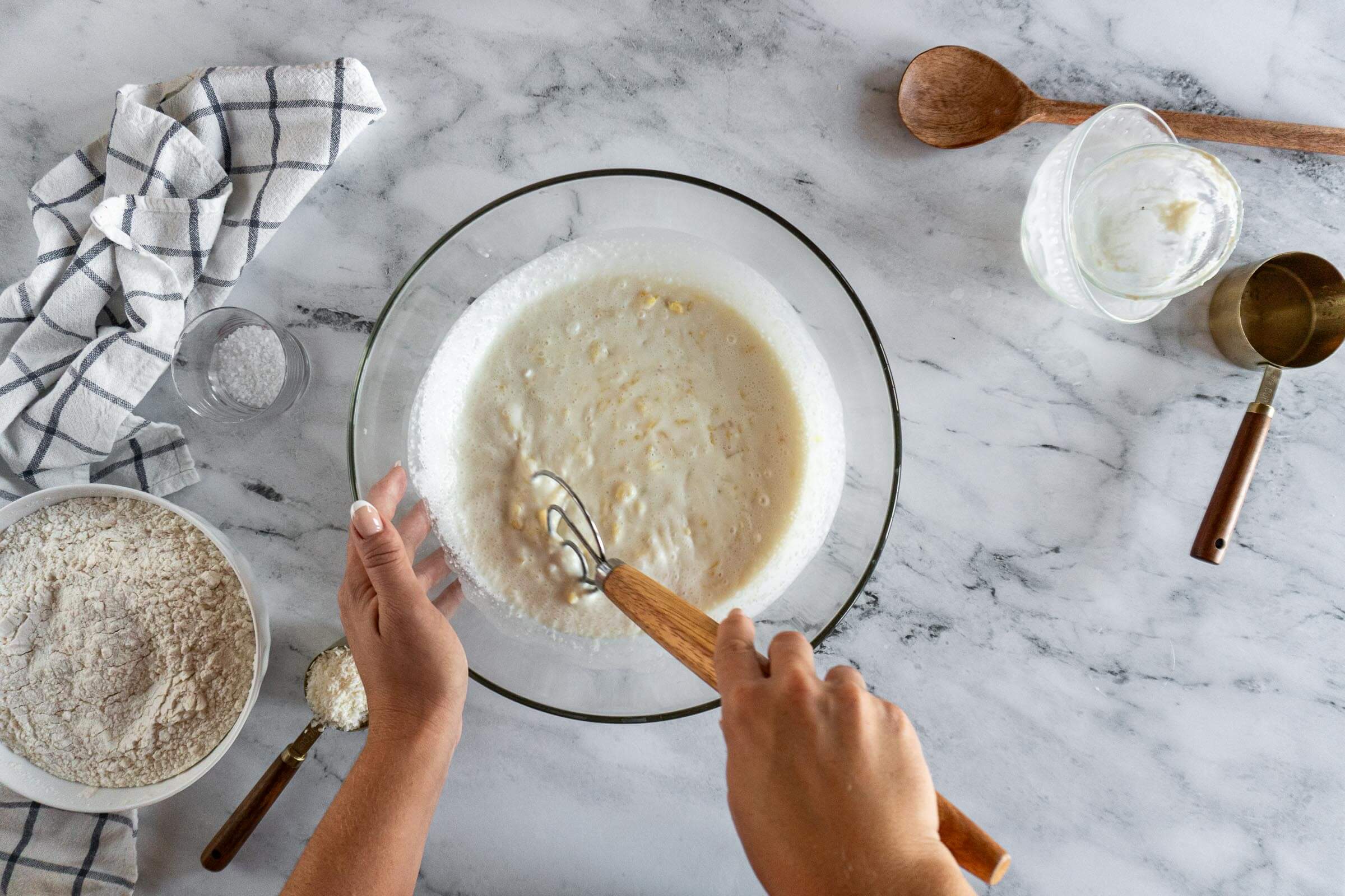 Whisking liquid ingredients together.