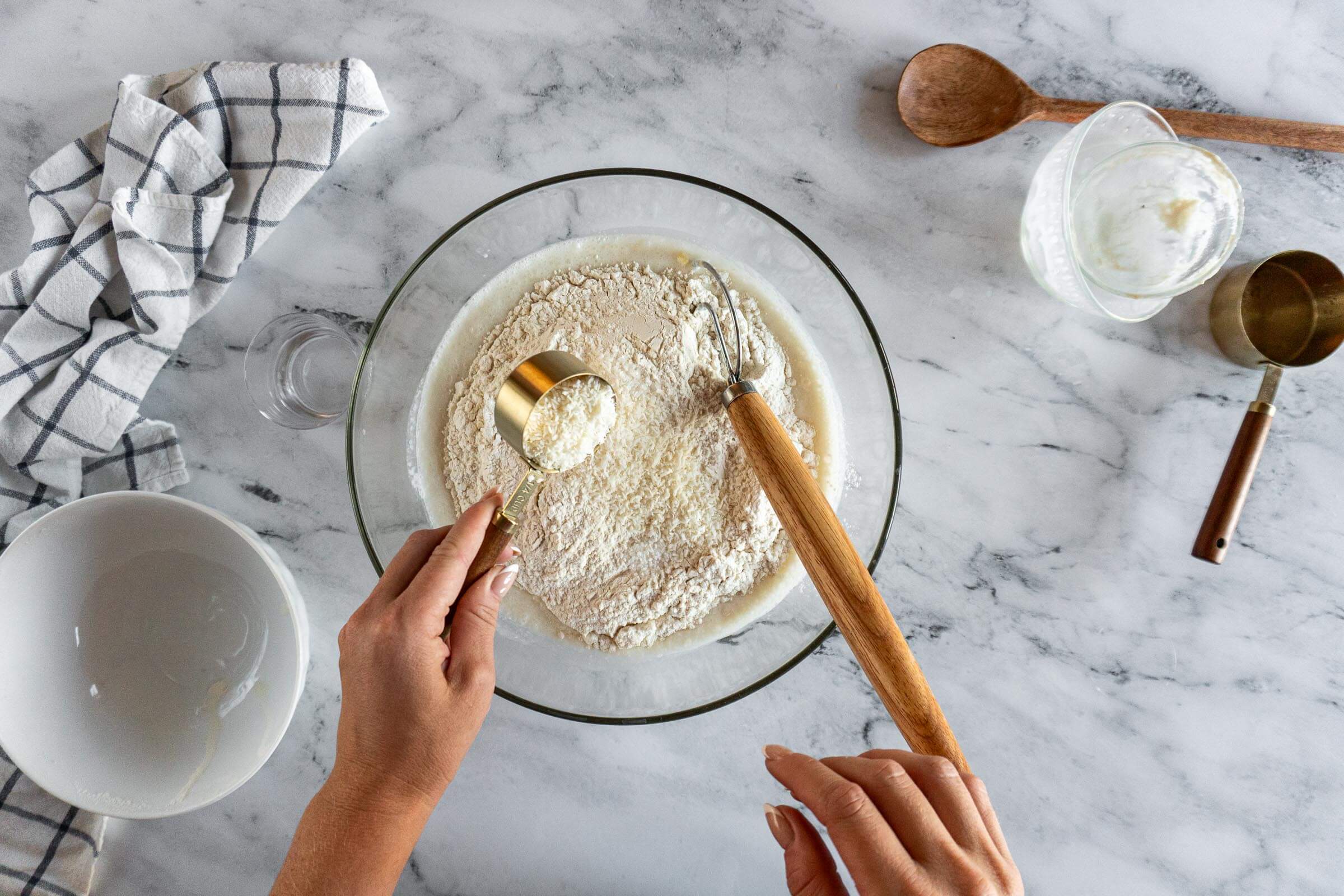 Adding flour, coconut and salt. 