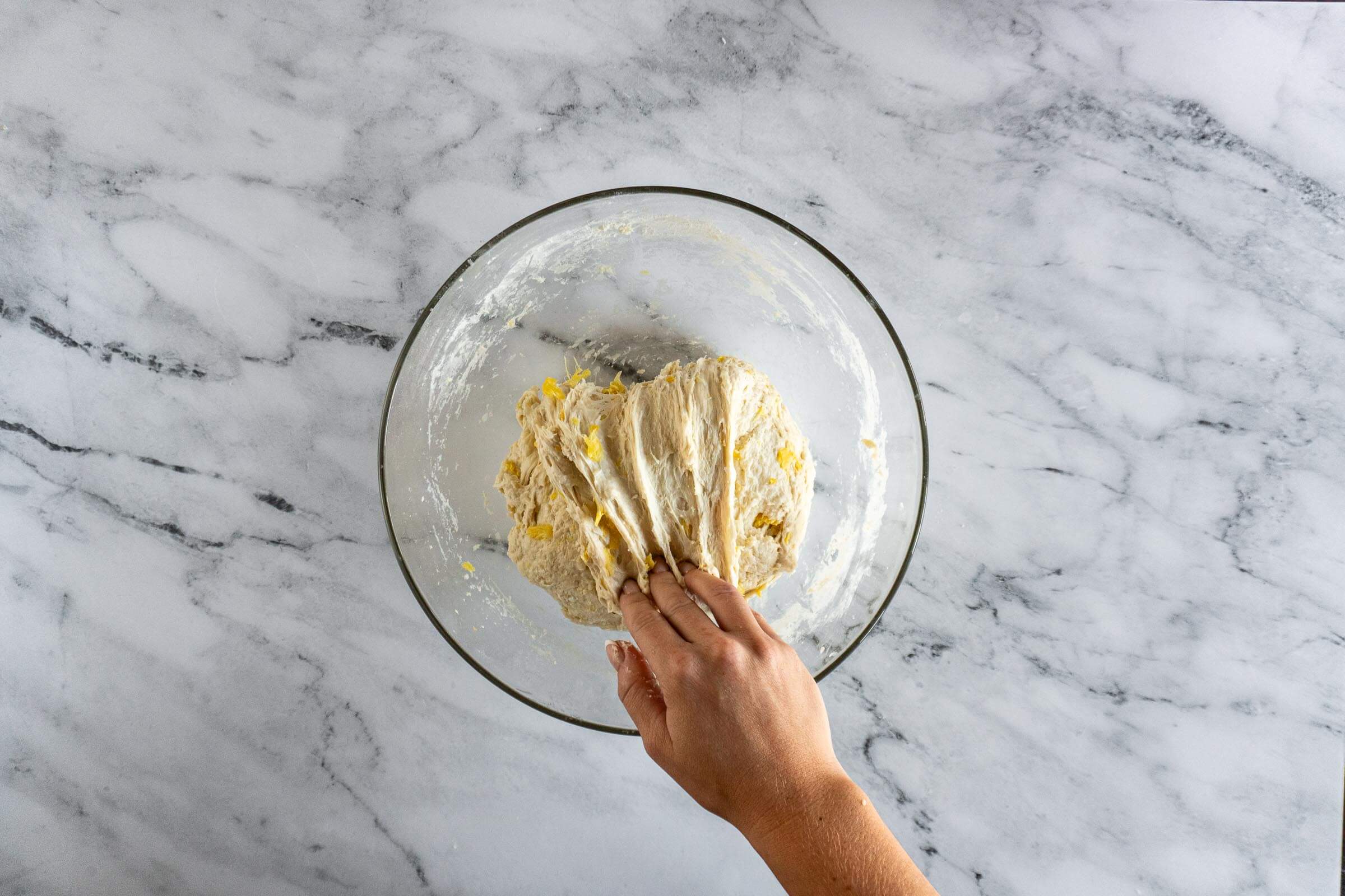 Folding pineapple coconut sourdough. 