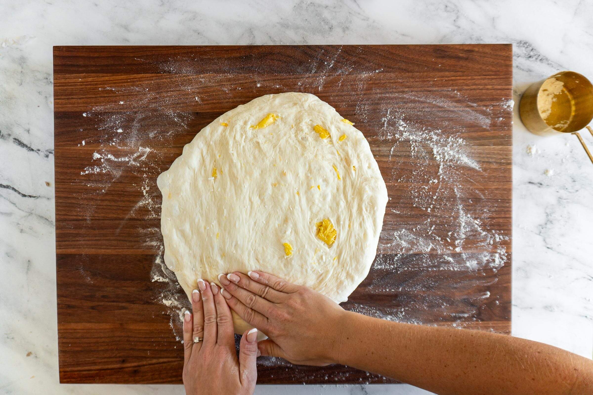 Pressing pineapple sourdough flat. 