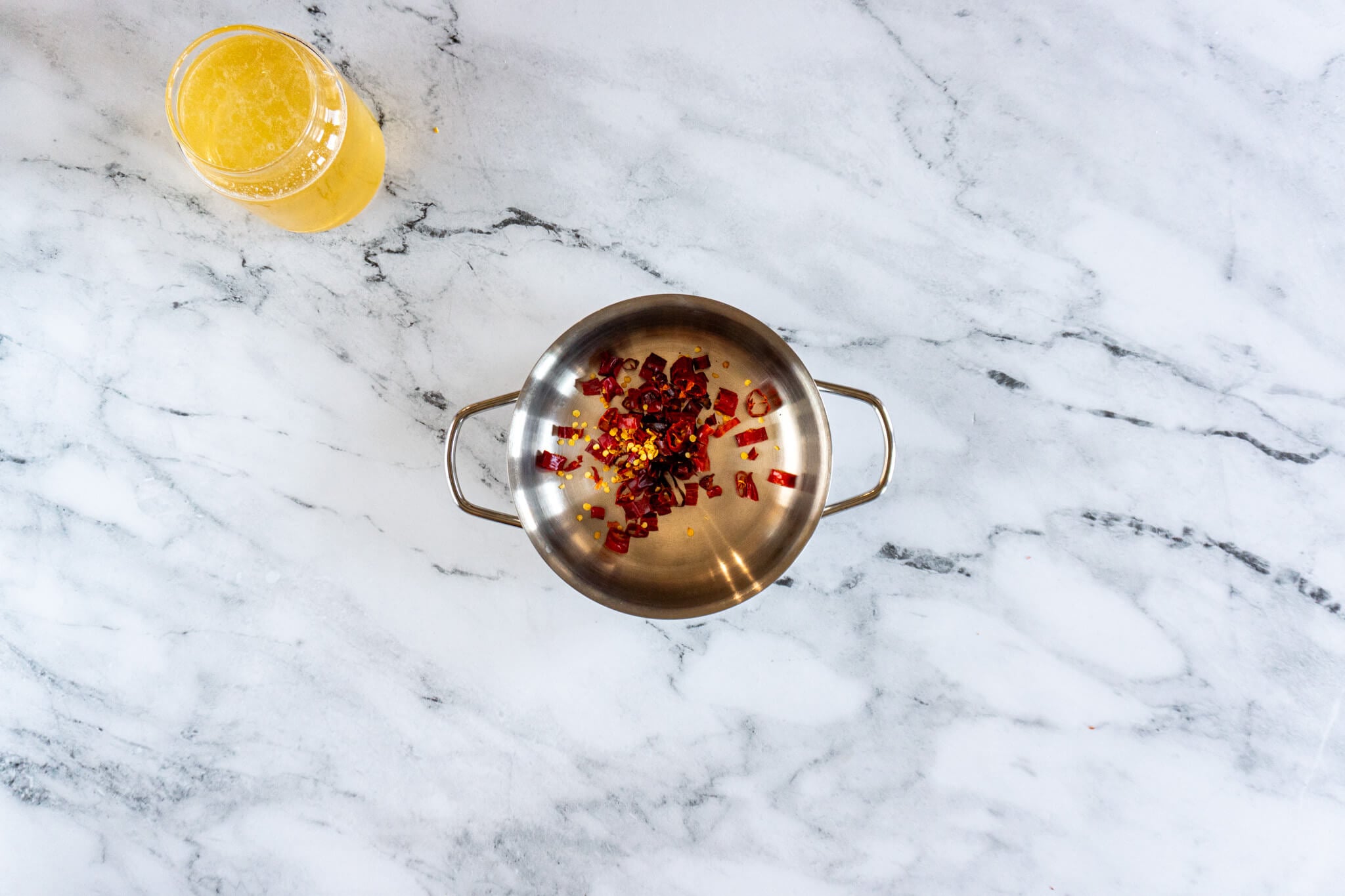 Chopped dried peppers in a small saucepan. 