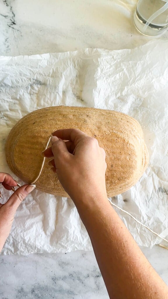 Spreading twine across the dough 