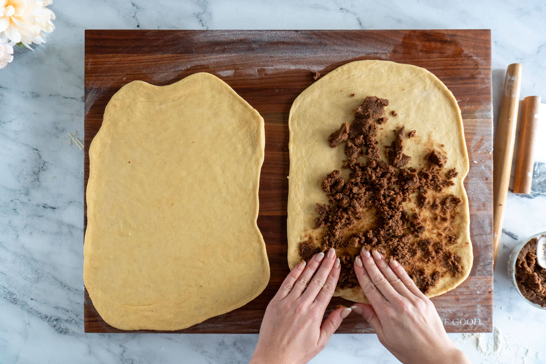 Spreading filling on half the dough.