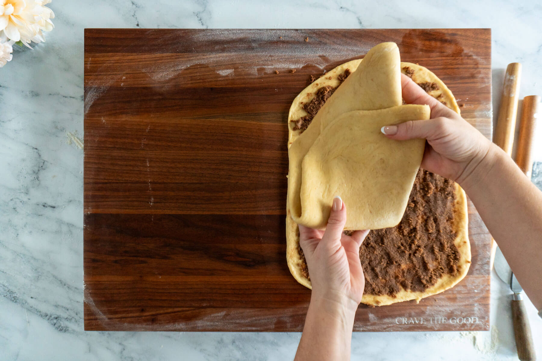 Placing the second dough sheet on top the first. 