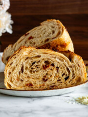 Sun dried tomato and parmesan sourdough bread sliced in half.