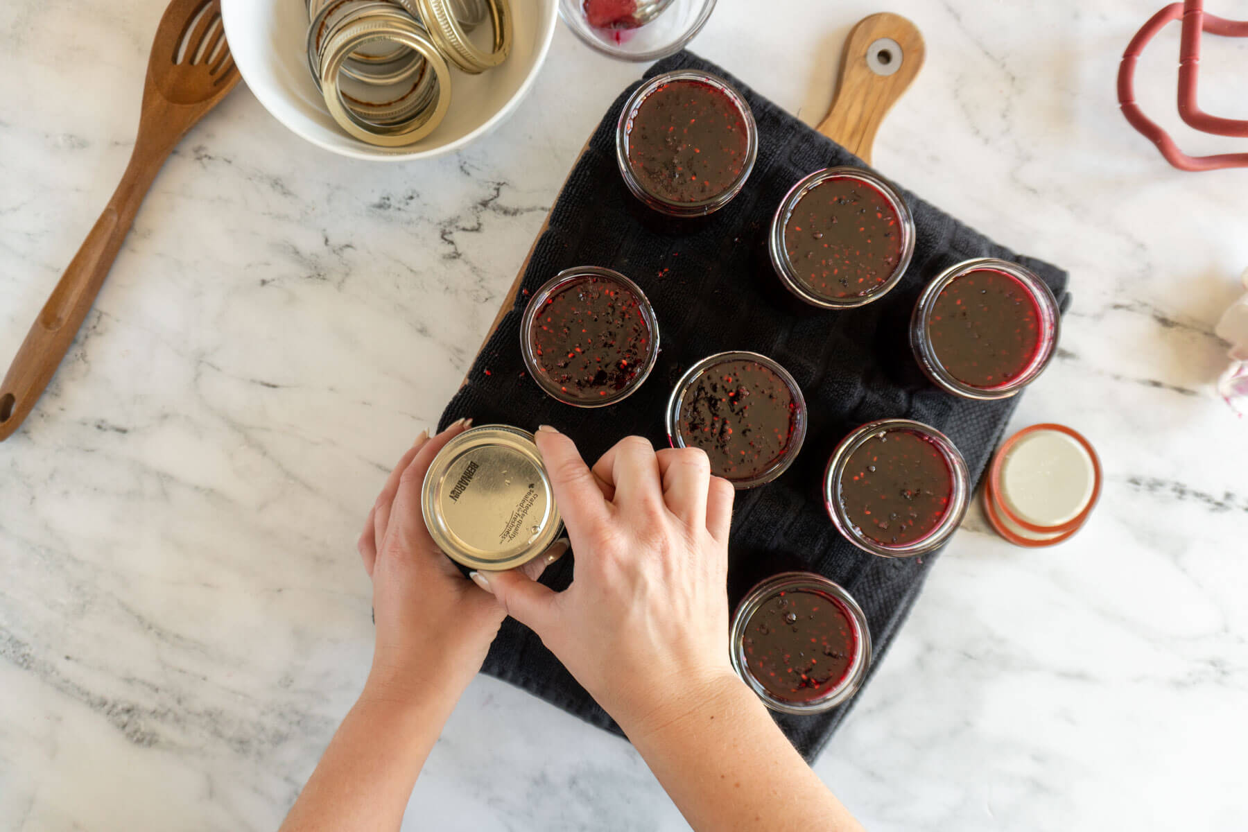 Securing the rings before water bath canning.