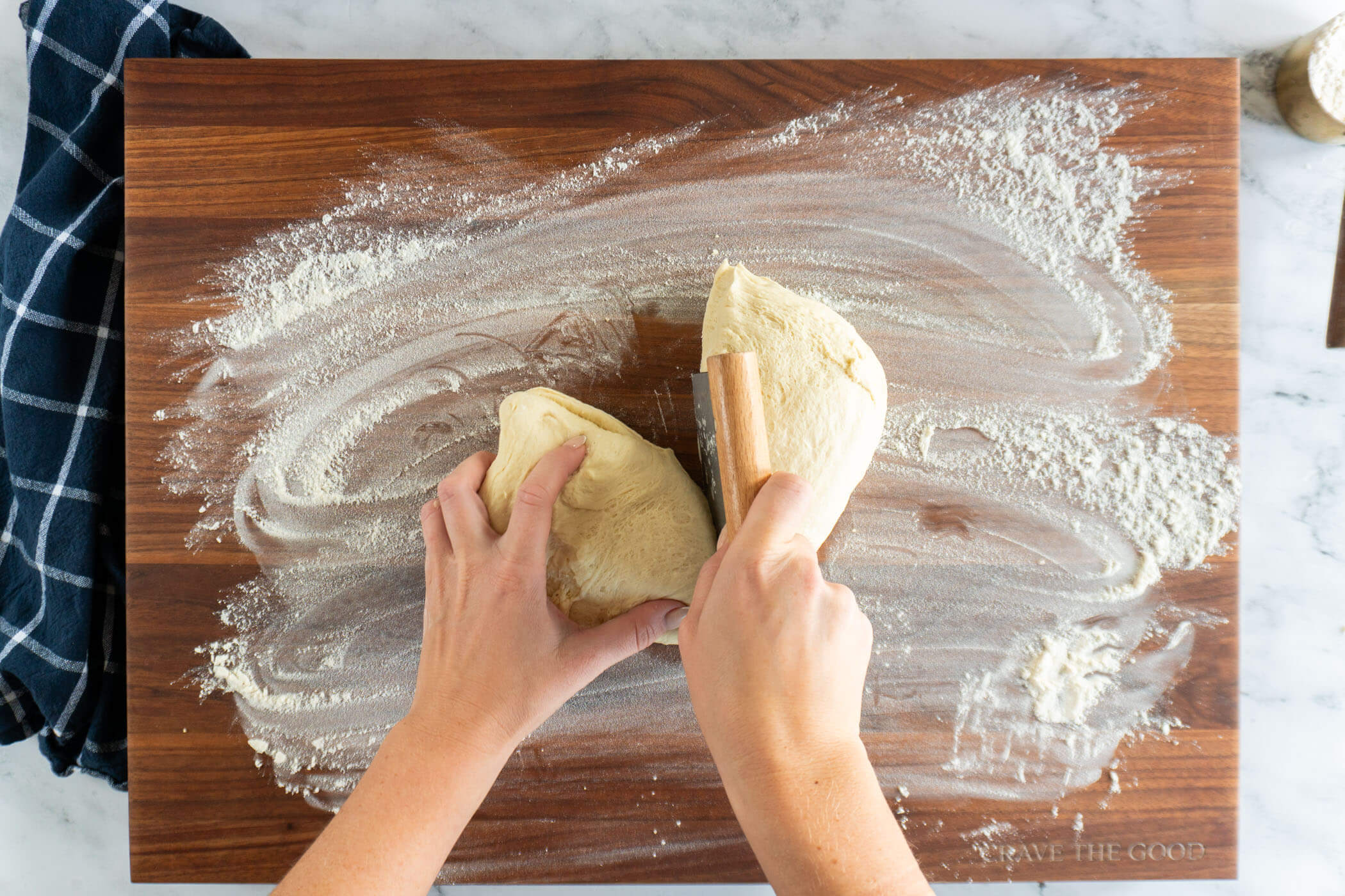 Separating the dough with a dough knife. 