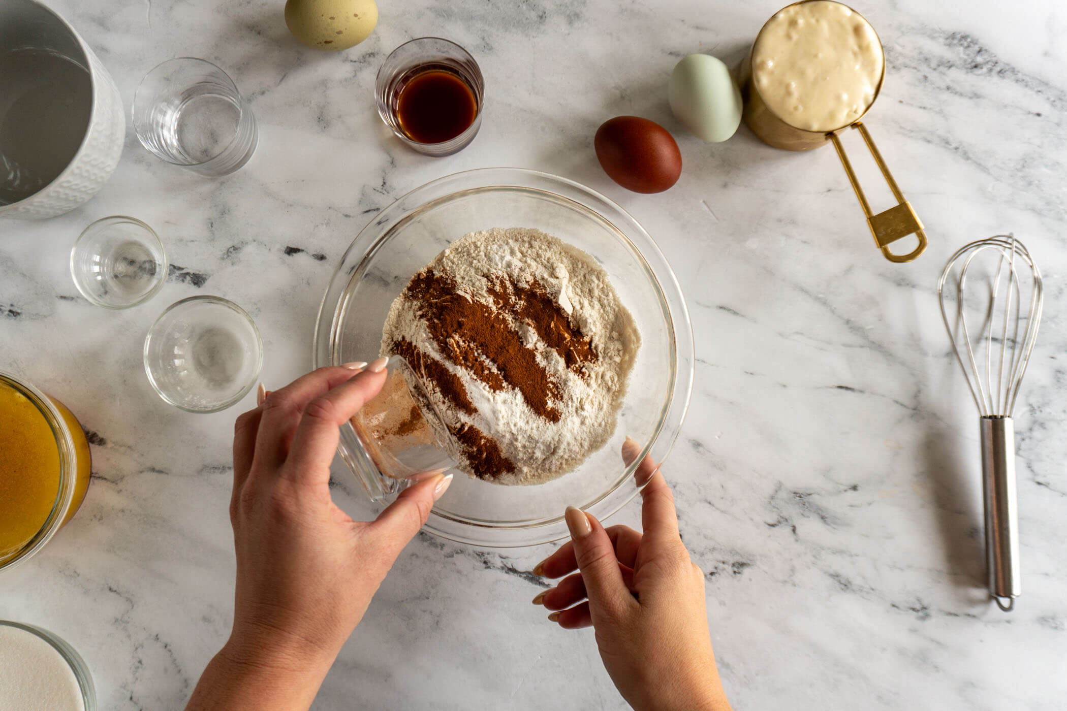 Adding dry ingredients to the bowl.