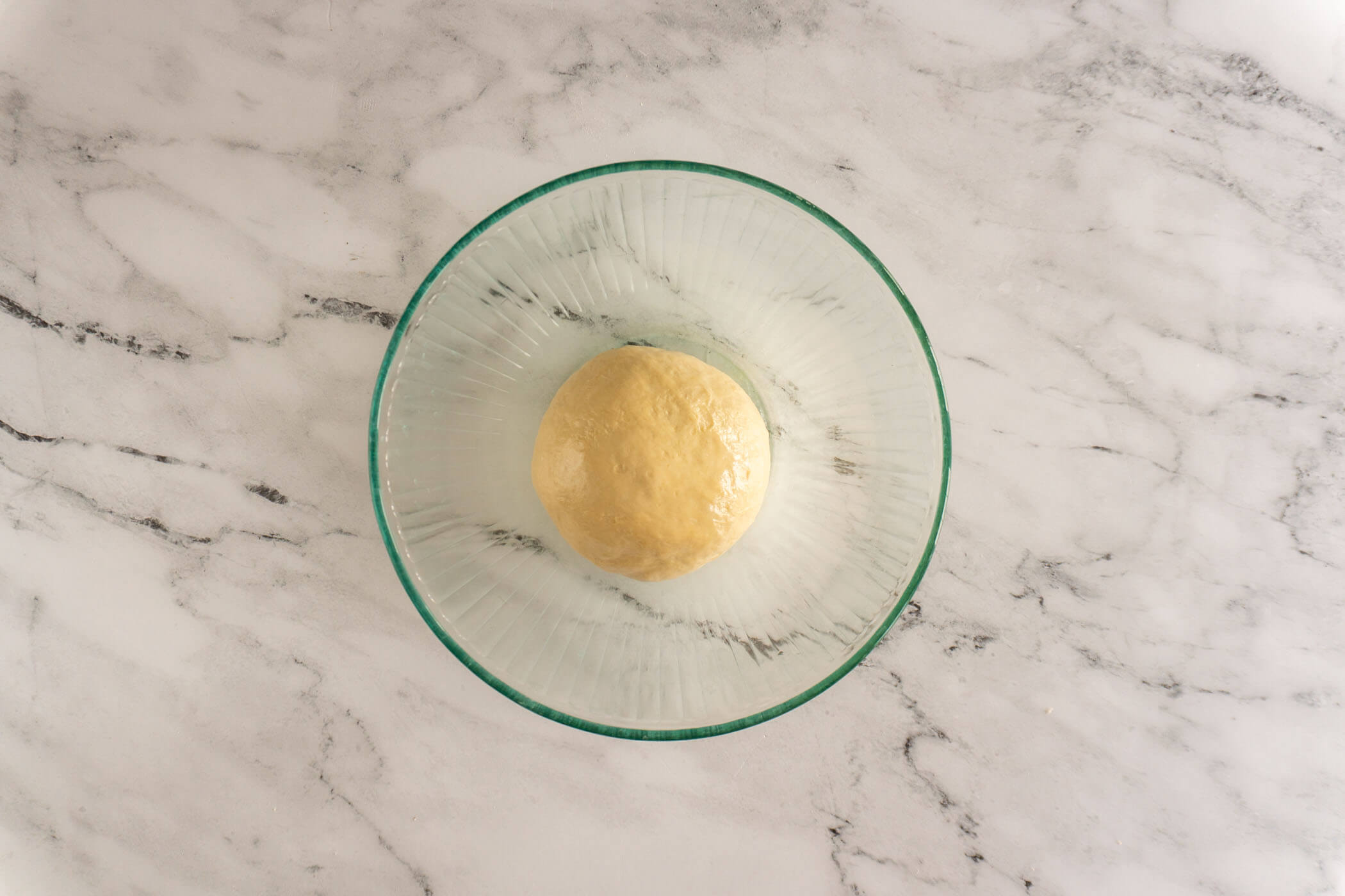 Dough transferred to a greased bowl. 