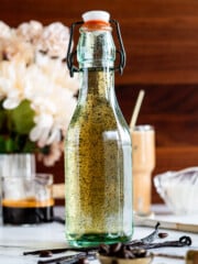 Homemade vanilla syrup in a flip top bottle.