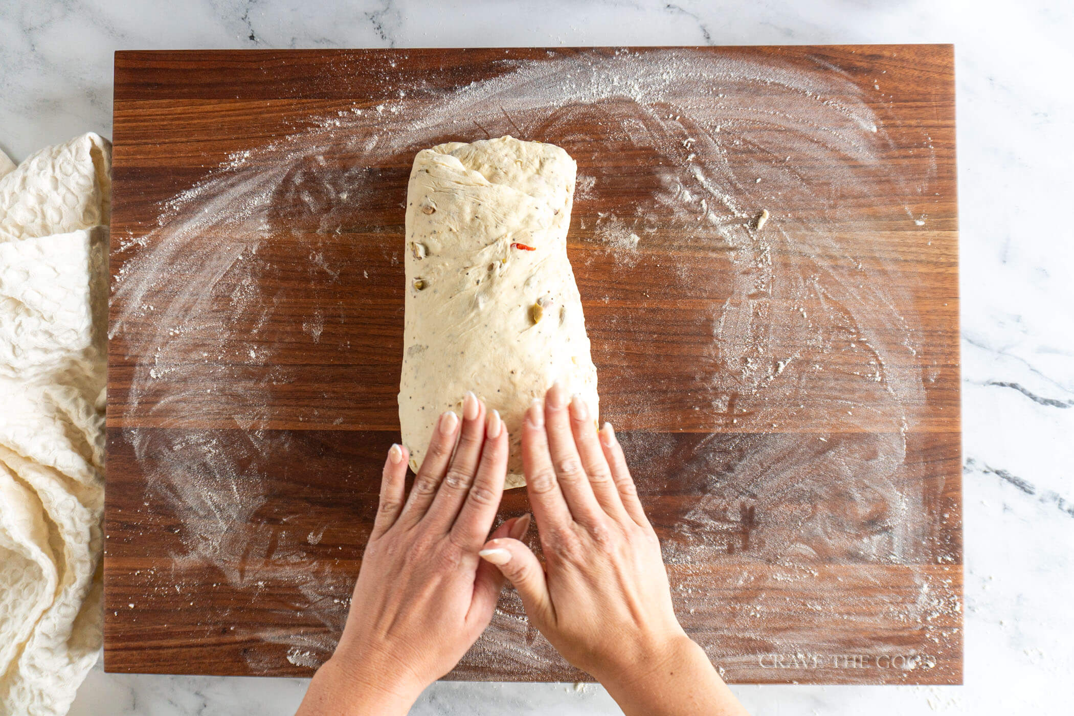Folding in both sides of the dough.