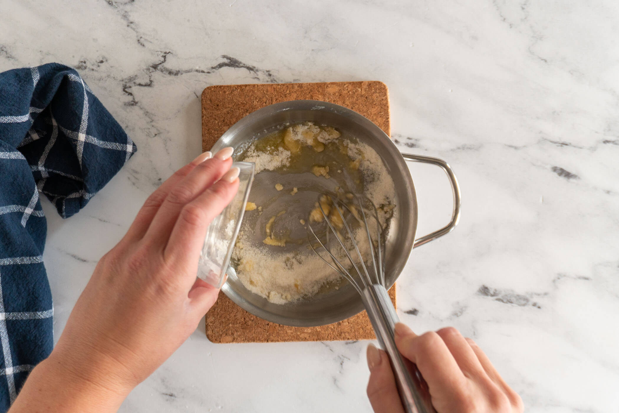 Whisking in sugar and flour. 