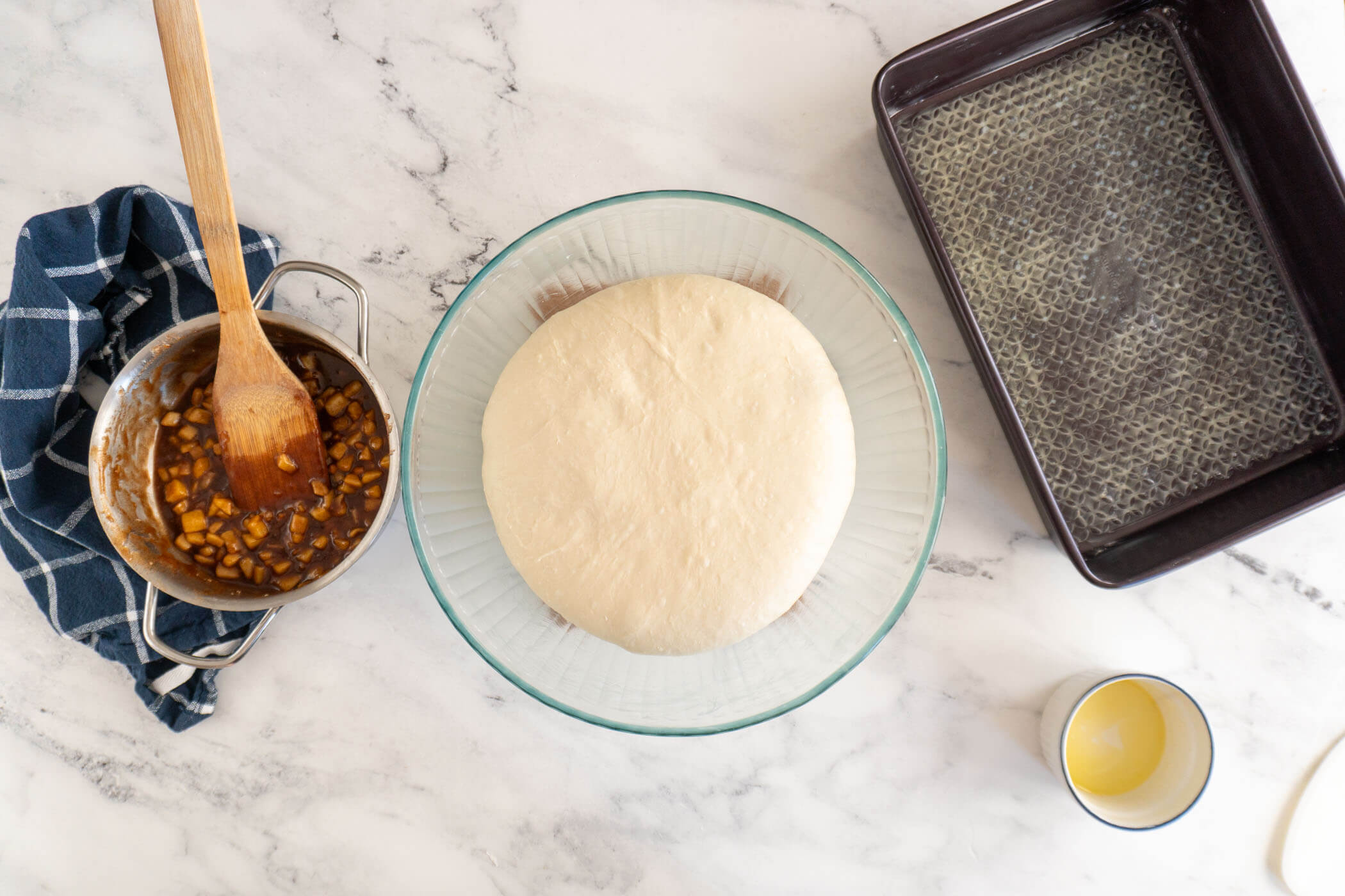 Fully bulk fermented dough in a glass bowl. 