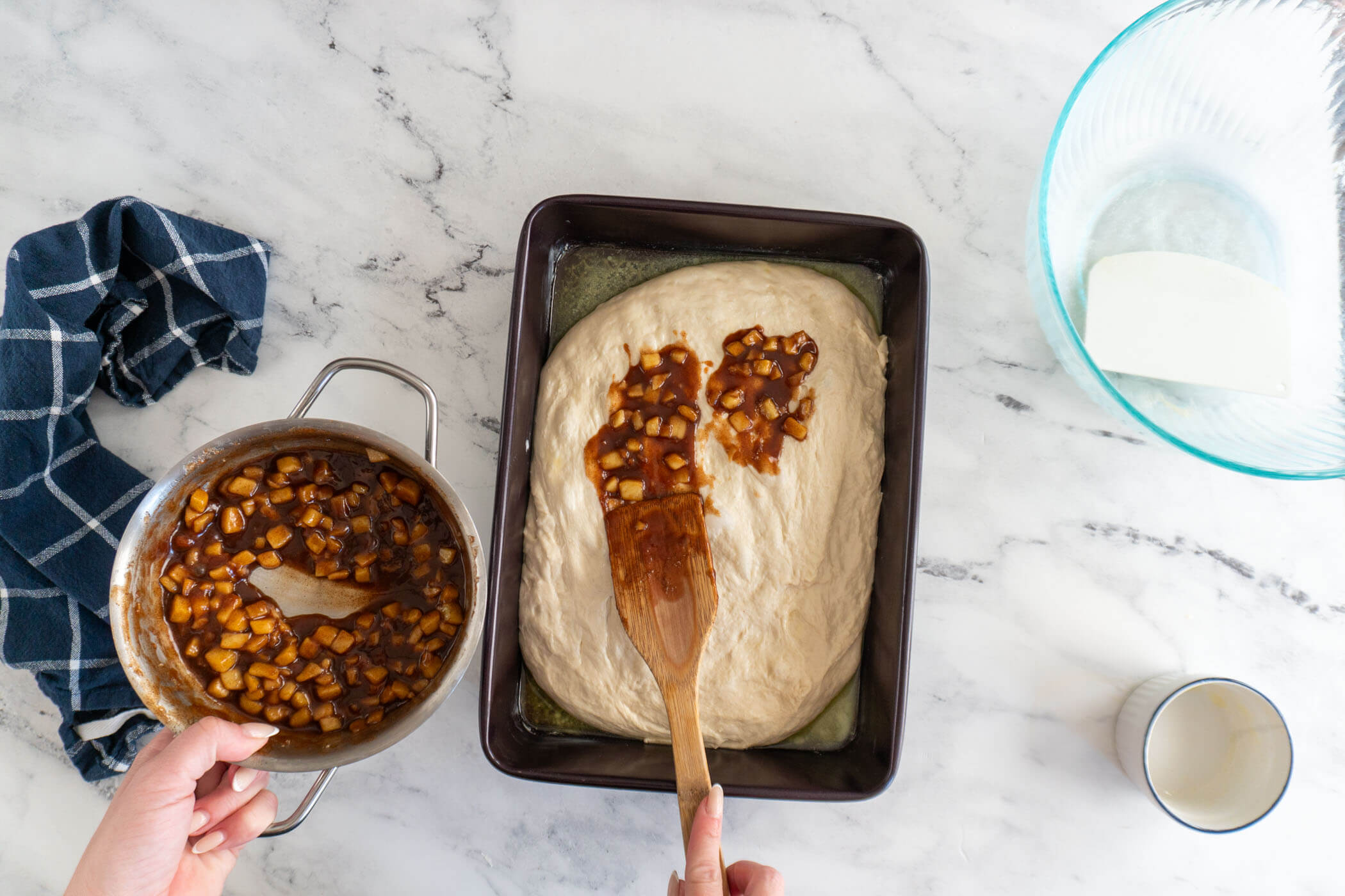 Spreading half the apple fritter filling. 