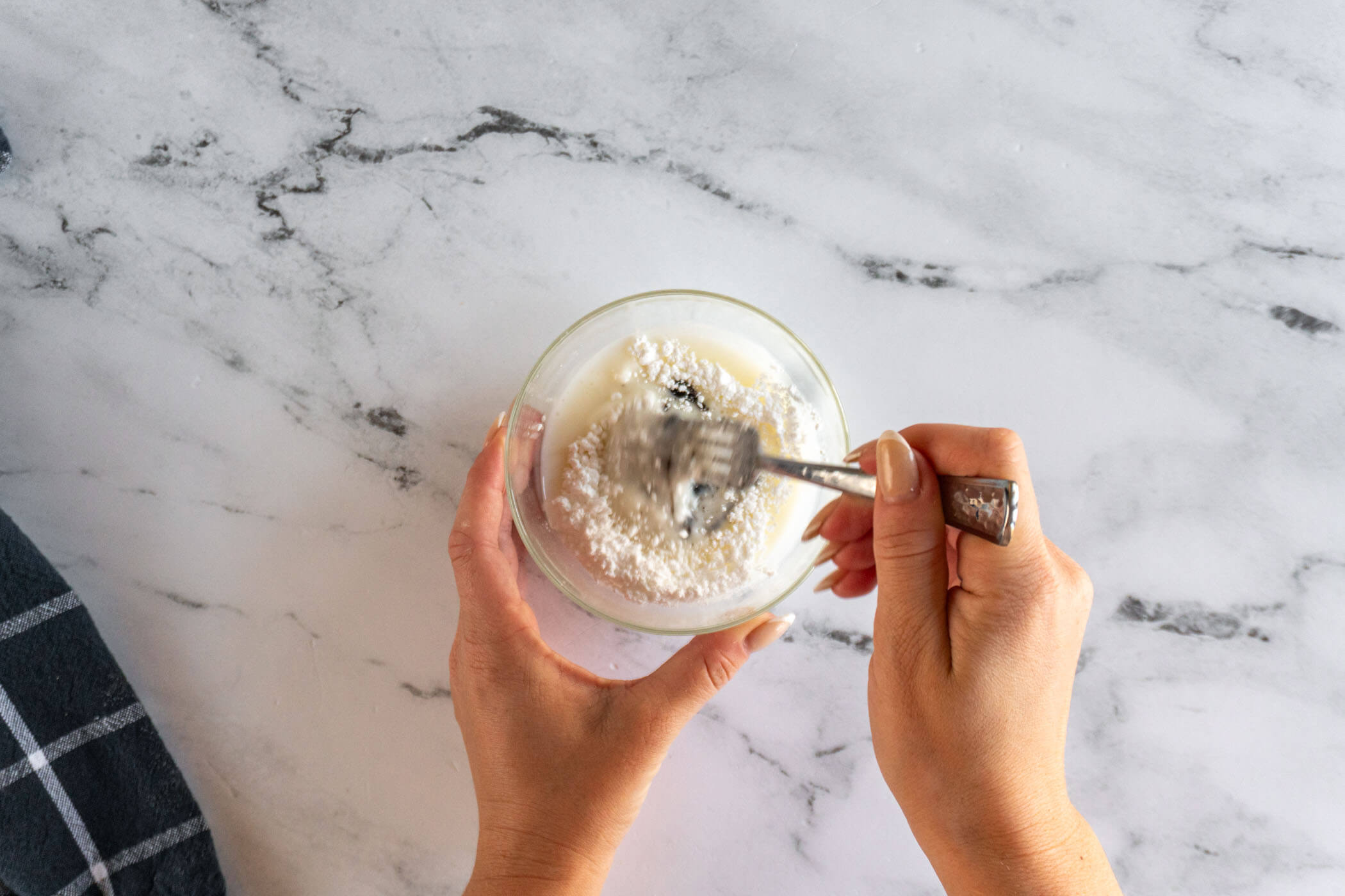 Whisking together the glaze. 