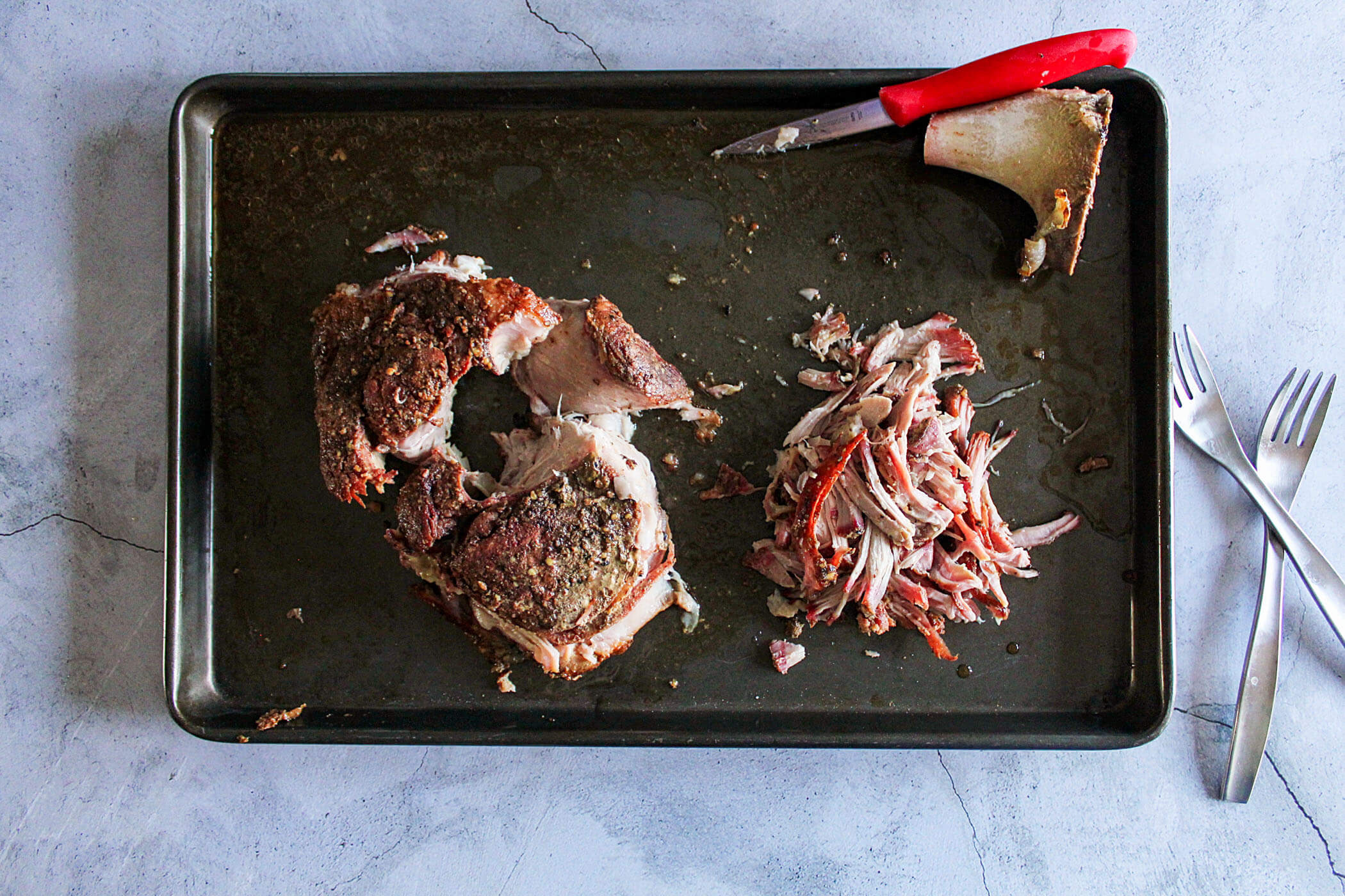 Bone removed and pork picnic shredded.