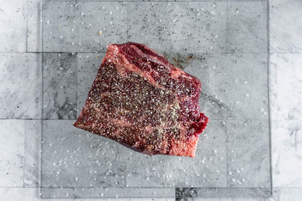 Beef blade roast generously seasoned with salt, pepper and garlic. 