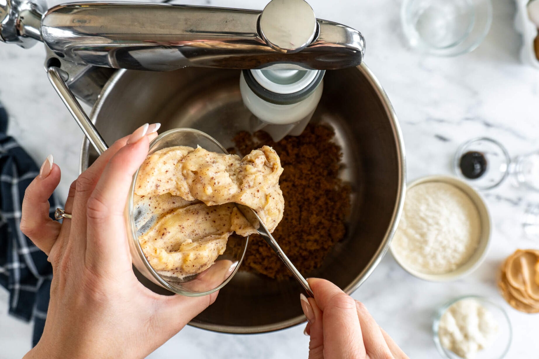 Adding browned butter to mixing bowl. 