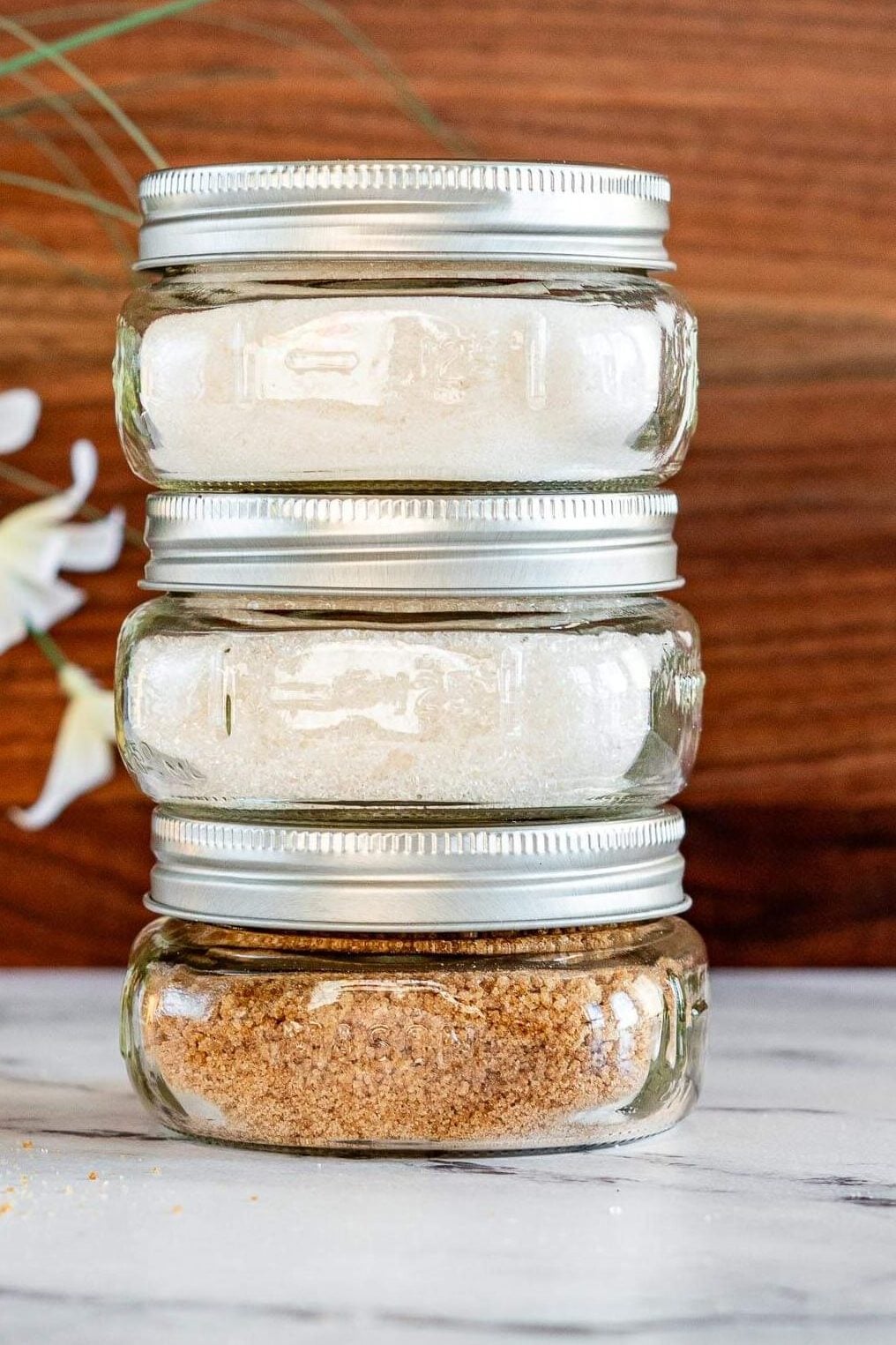 Stack of smoked sugar in mason jars.