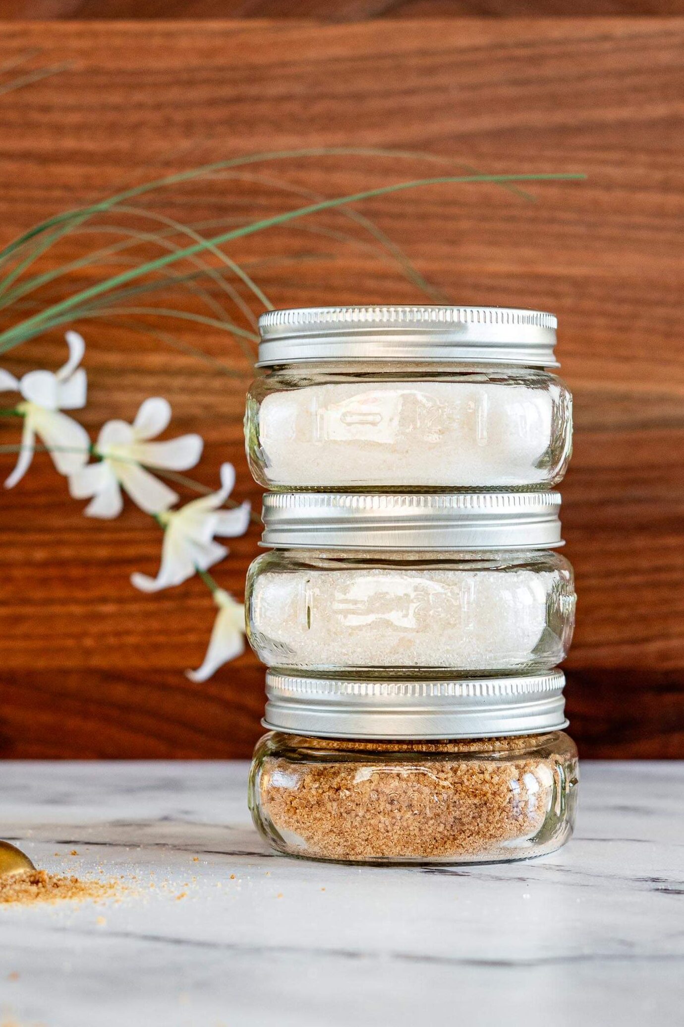 Stack of smoked sugar in mason jars.
